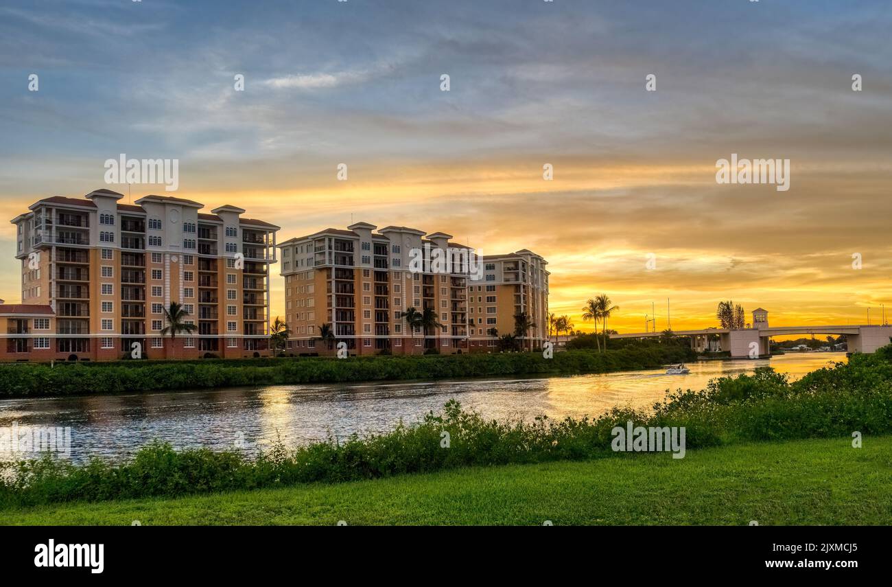 Sunset sky behind buildings along the Gulf Intracoastal Waterway in Venice Florida USA Stock Photo