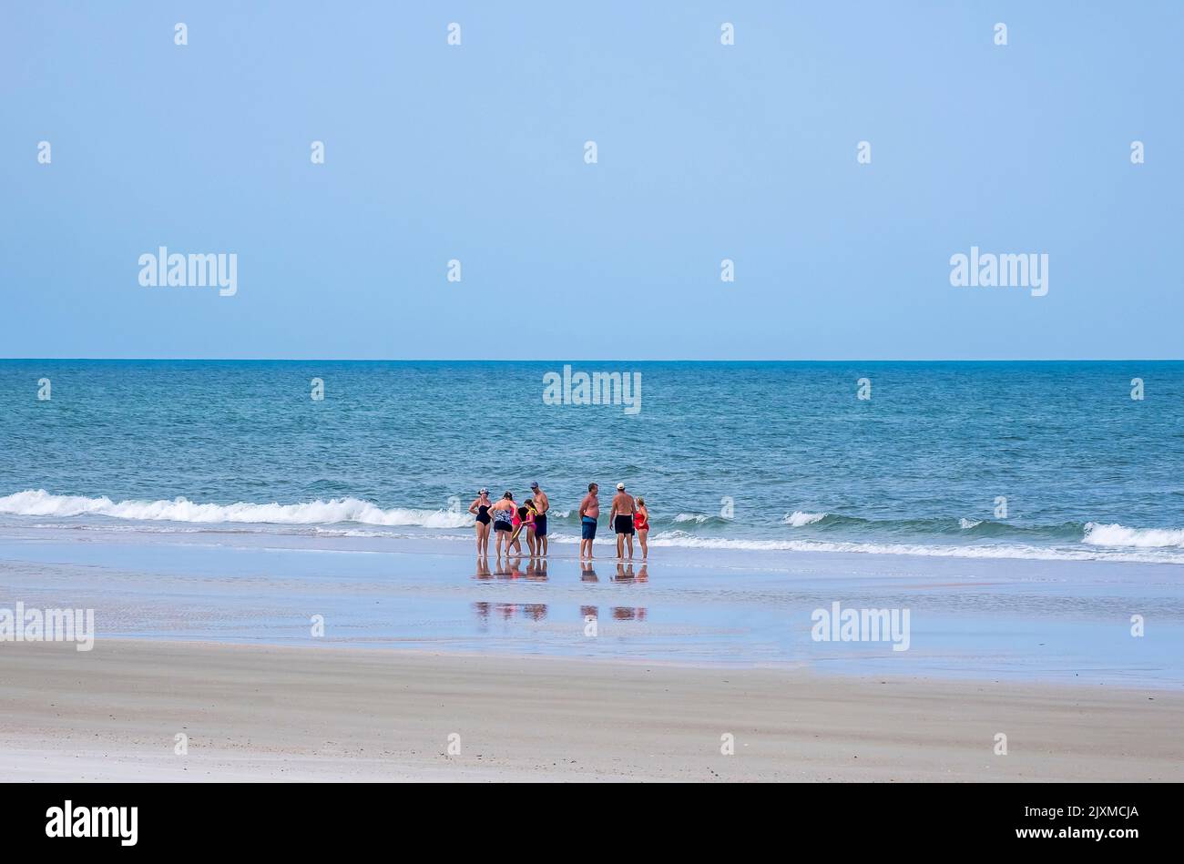 Group of people on the Atlantic Ocean beach in Northeast Florida USA Stock Photo