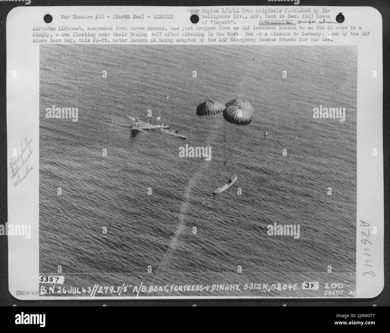 Airborne Lifeboat, suspended from three chutes, has just dropped from an RAF Lockheed Hudson to an 8th AF crew in a dinghy, shown floating near their Boeing B-17 after ditching in the North Sea on a mission to Germany. Used by the RAF since last May Stock Photo