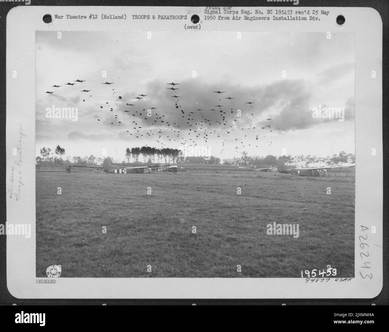 Waves Of Yankee Paratroopers Drop From Troop Carrier Planes Near Grave