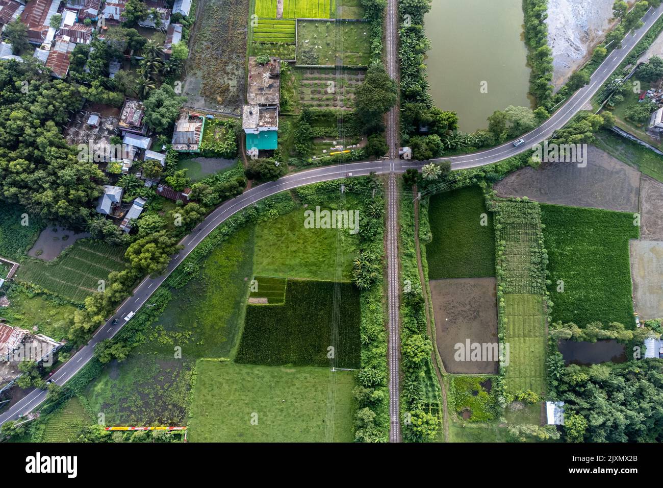 Railway line and bus line crossing pattern Stock Photo - Alamy
