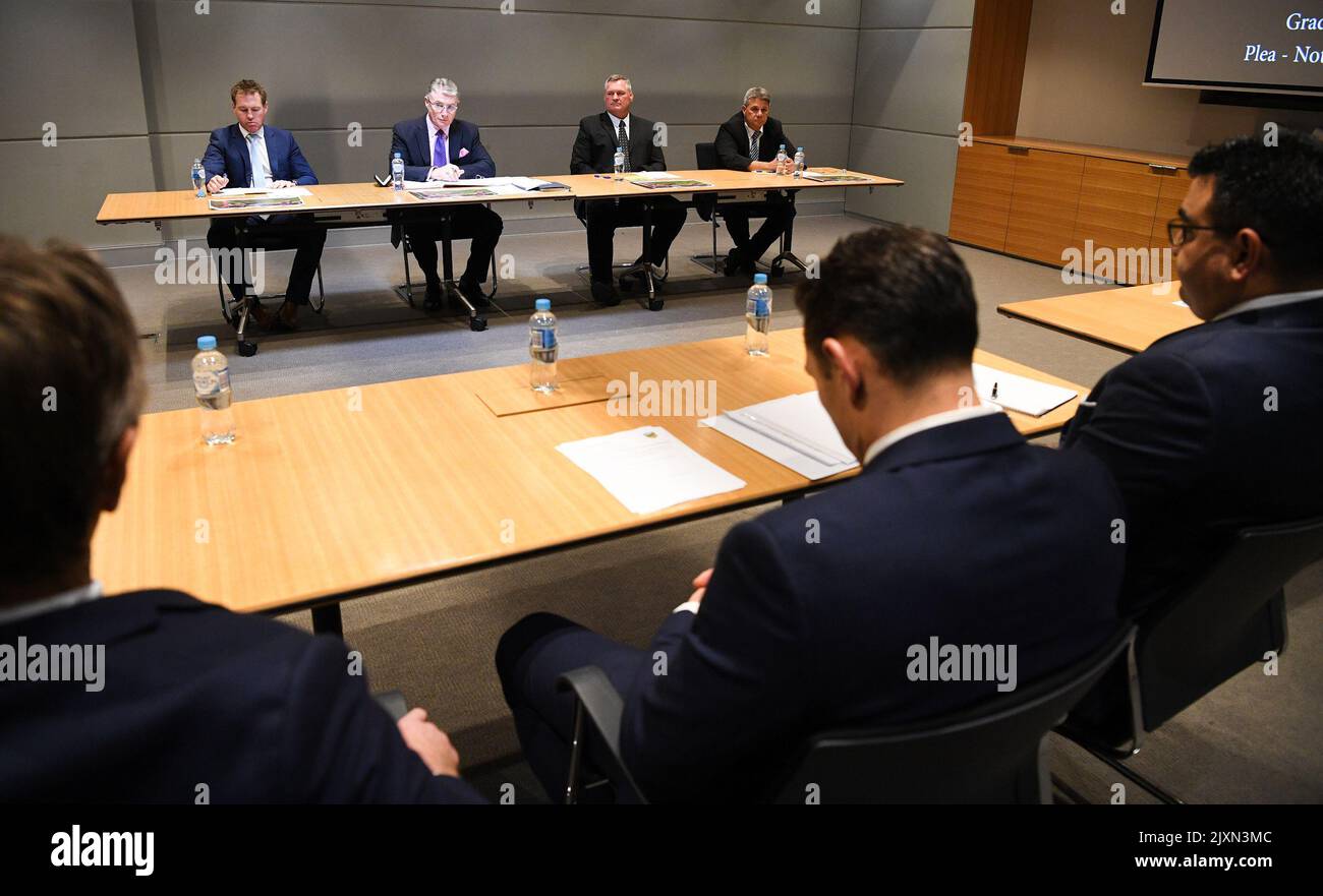 Melbourne Storm NRL player Billy Slater (centre) and Craig Bellamy (right) are seen at NRL Central for his shoulder charge judiciary hearing in Sydney, Tuesday, September 25, 2018