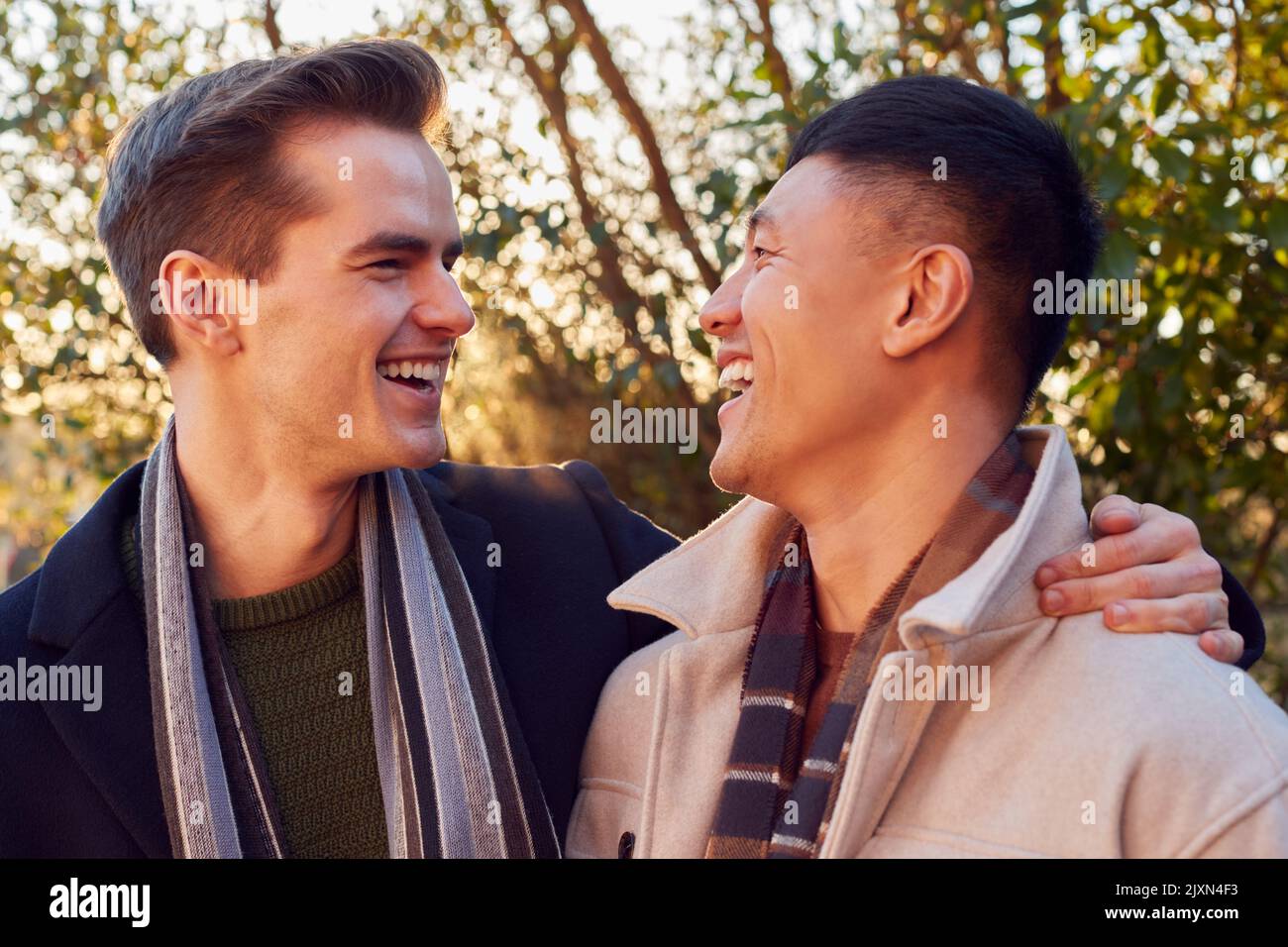 Loving Same Sex Male Couple On Walk In Countryside Together Stock Photo