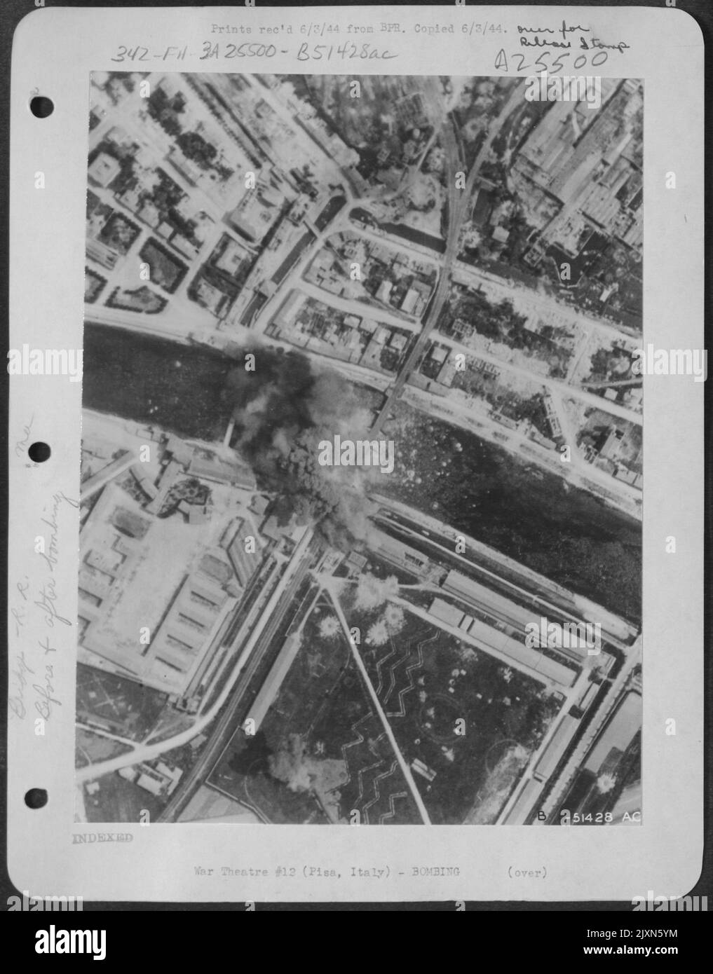 Falling debris landing in the water as exploding bombs do their damage ...