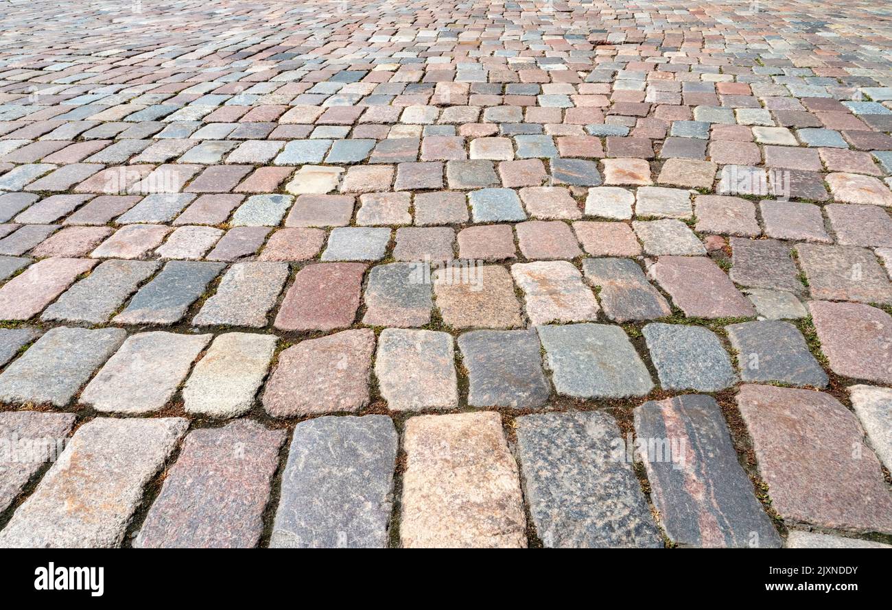 Natural old cobblestone sidewalk or pavement, top view, as texture or background Stock Photo