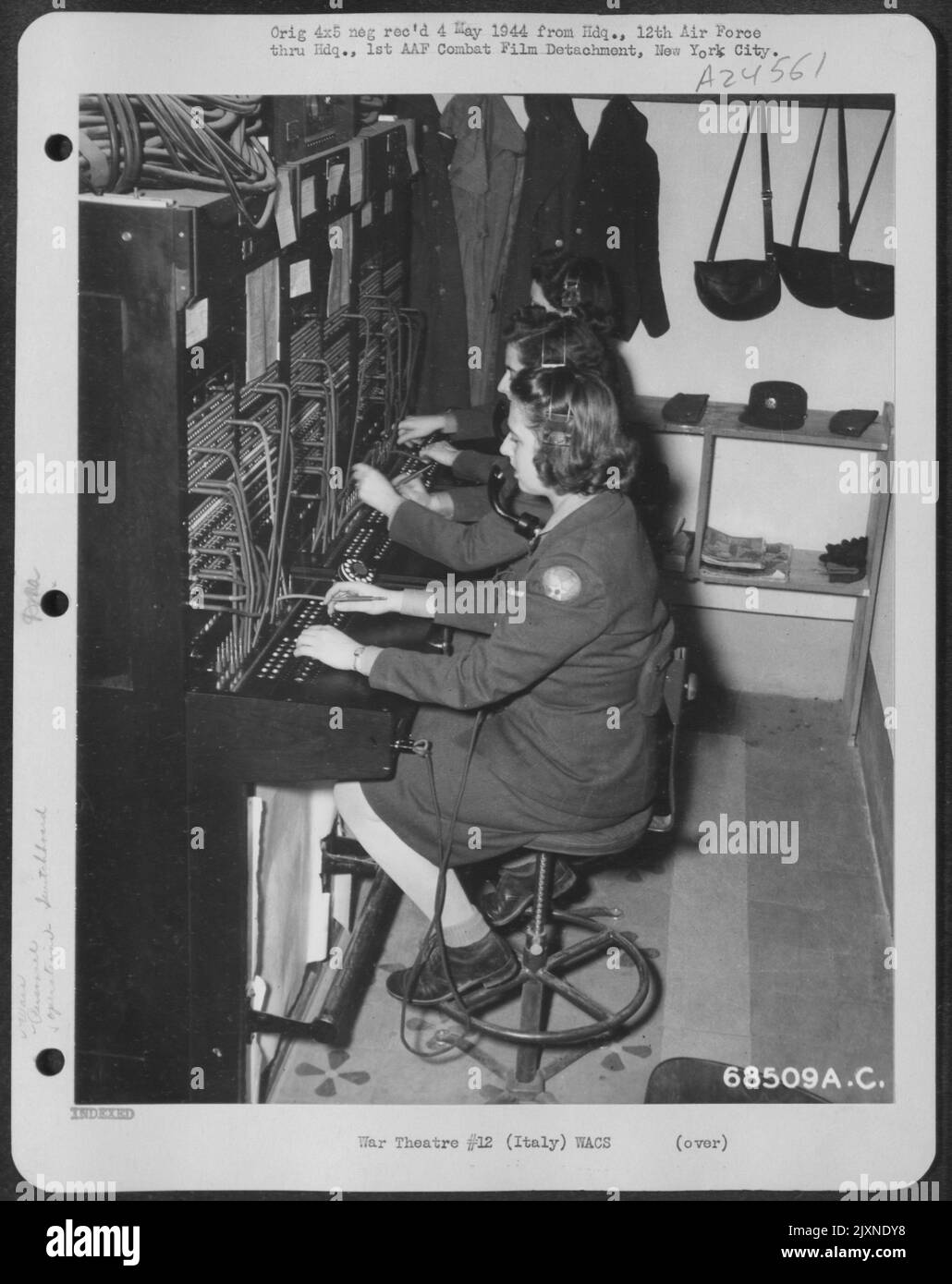 Rapid Communications Are A Prime Necessity To A Modern Army. Telephone Calls To And From Headquarters Of The 12Th Air Force In Italy Are Efficiently Handled By (Front To Rear) Pvt. Gladys Duncan Of Haddonfield, Nj; Pvt. Adelbertine M. Adams Of Summit, Nj Stock Photo