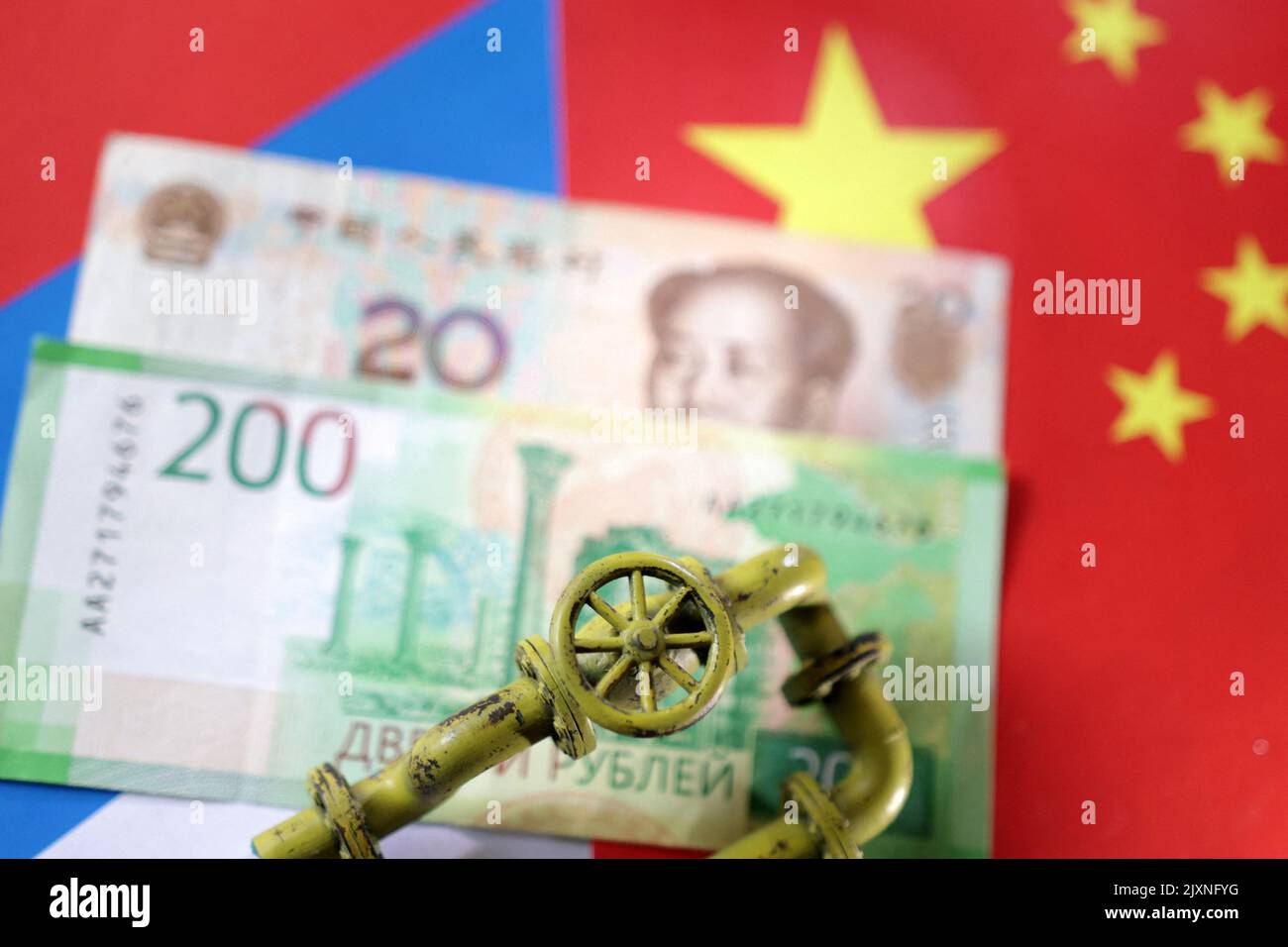 Model of natural gas pipeline, Russian and Chinese flags and Yuan and Rouble banknotes are seen in this llustration taken, September 7, 2022. REUTERS/Dado Ruvic/Illustration Stock Photo
