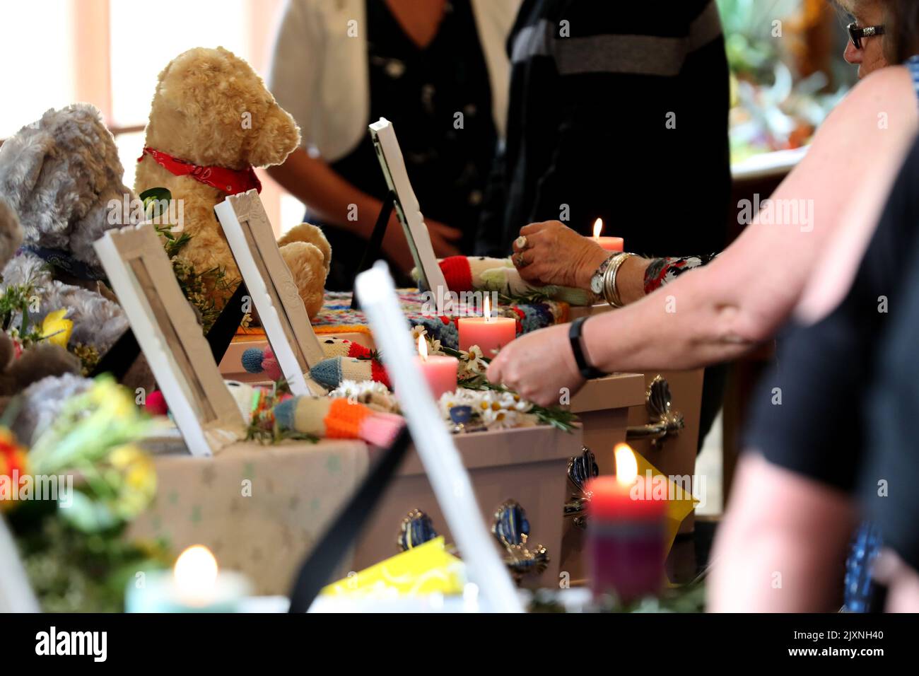 Mourners pay their respects during the funerals of Beverley Quinn, Mara