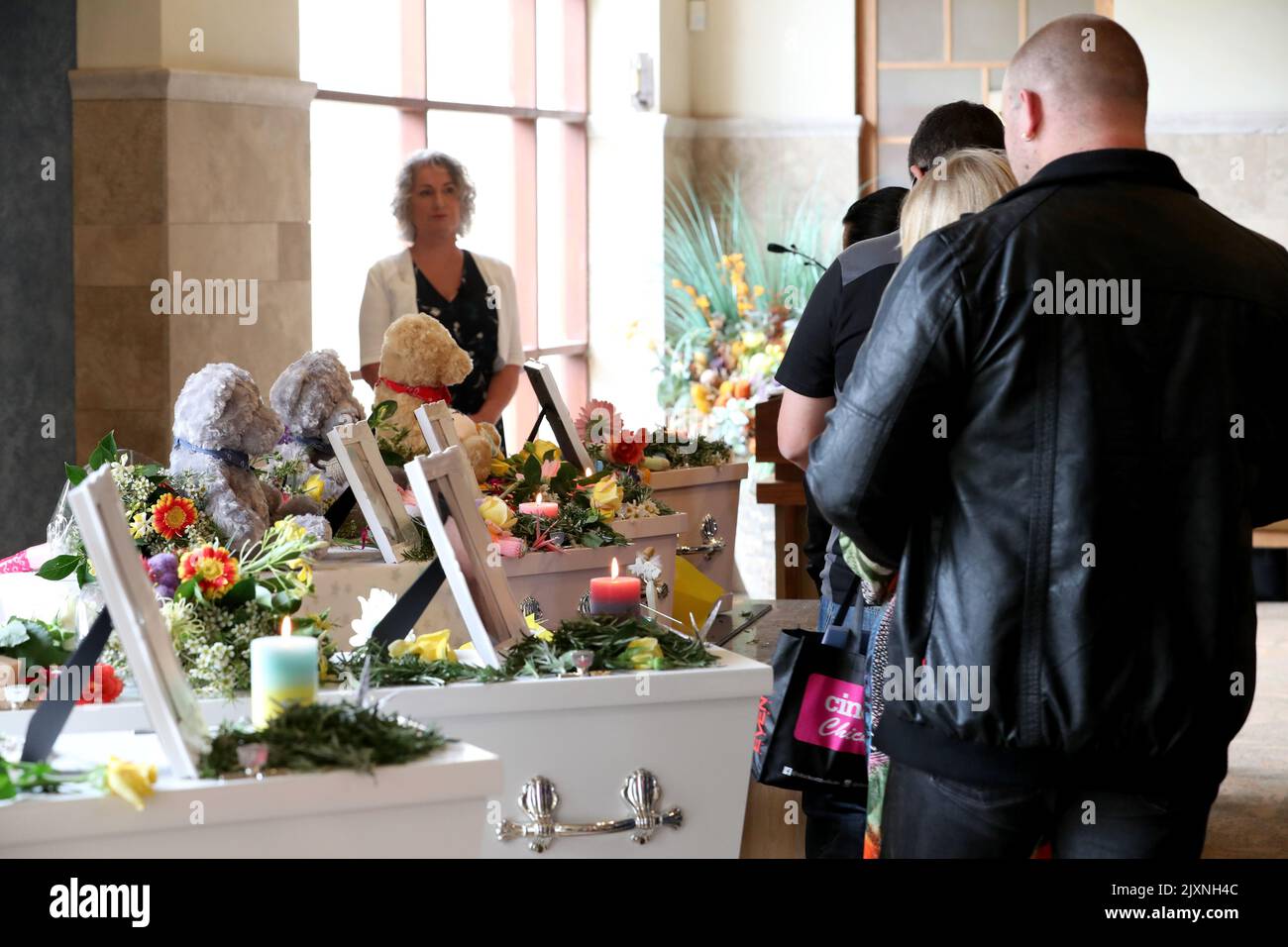 Mourners pay their respects during the funerals of Beverley Quinn, Mara