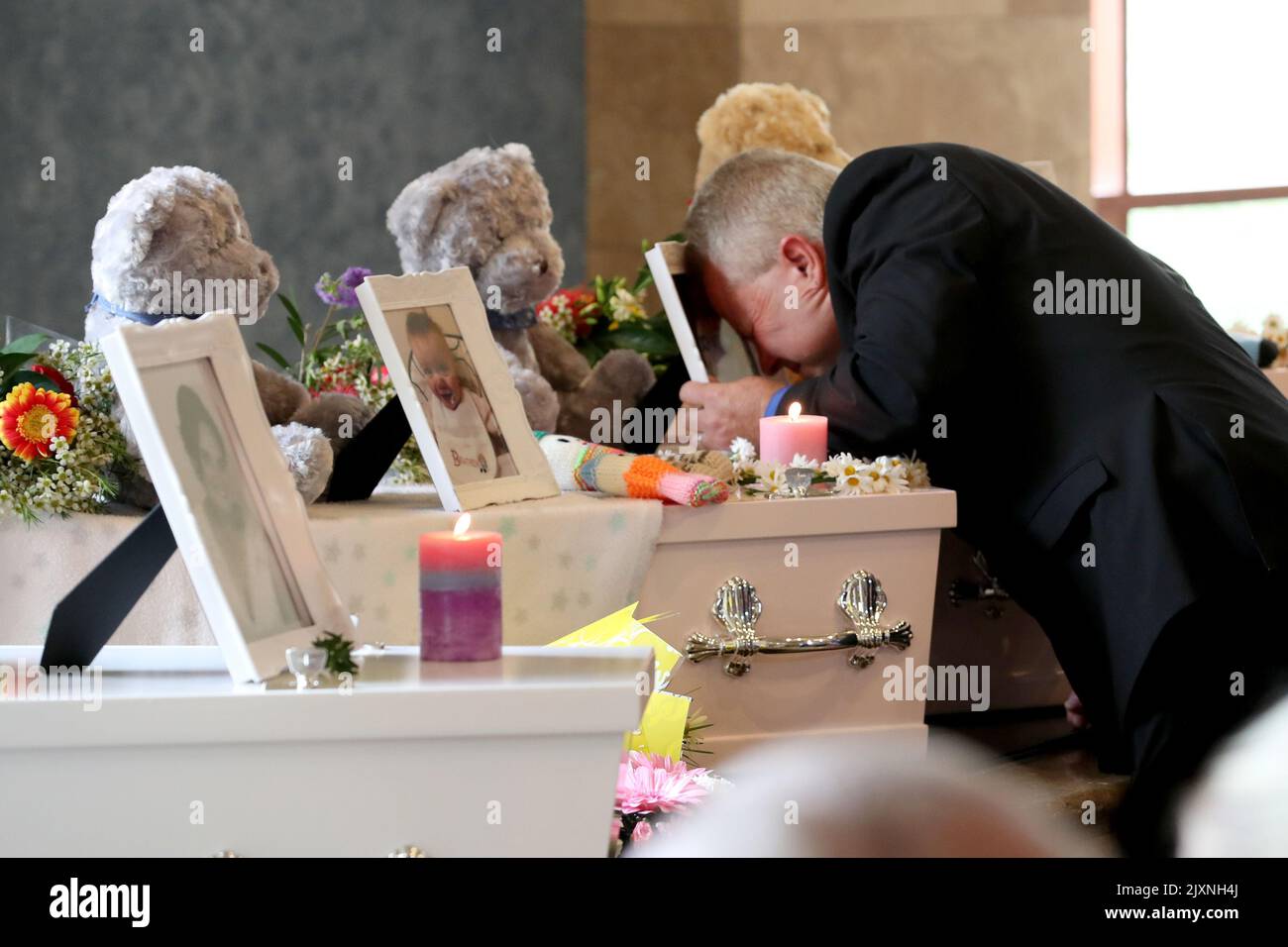 Mourners pay their respects during the funerals of Beverley Quinn, Mara