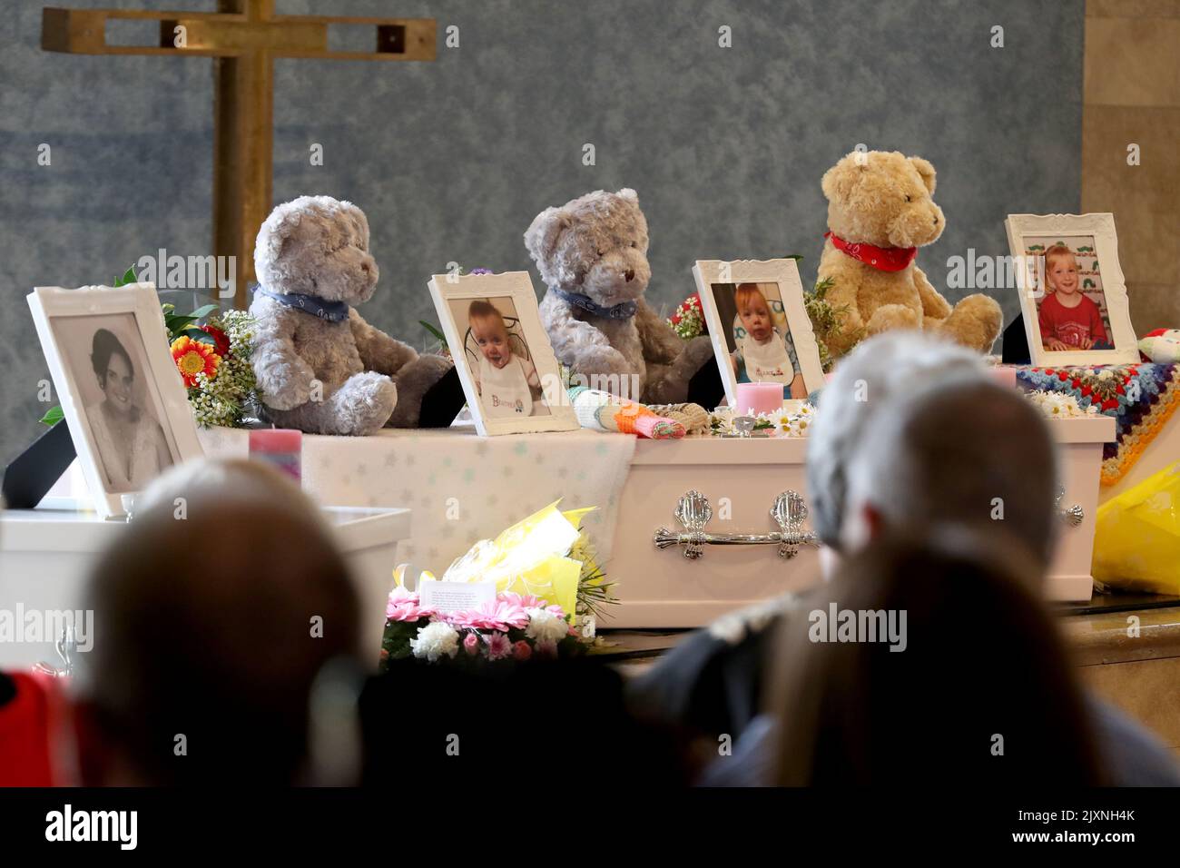 The coffins of (LR) Mara Harvey and her daughters Beatrix, Alice and