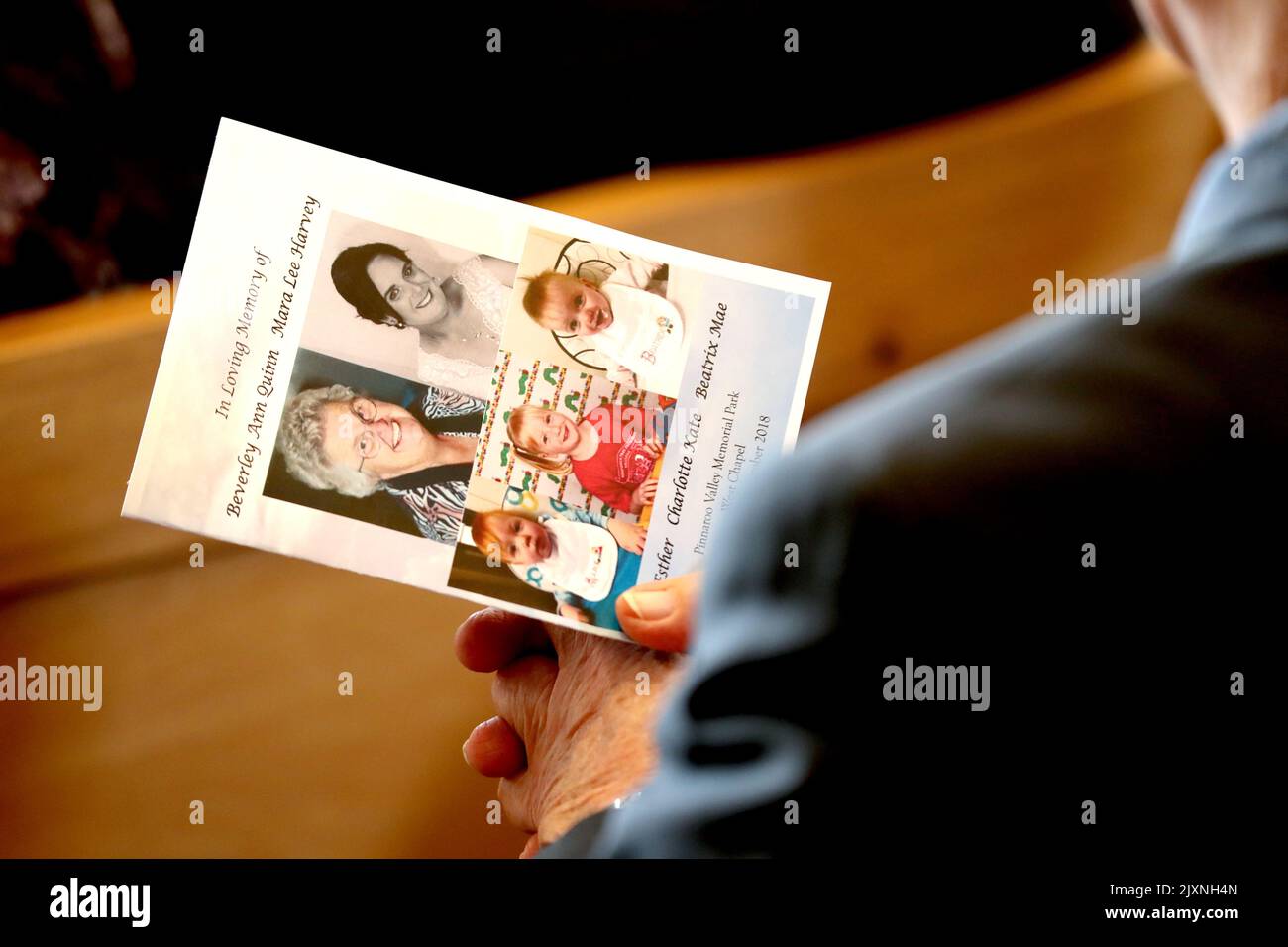 A mourner holds an Order of Service during the funerals of Beverley