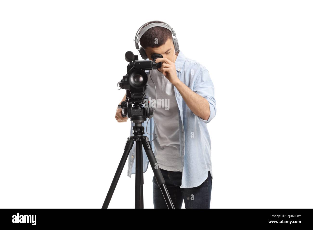 Cameraman recording with a camera on a tripod stand isolated on white