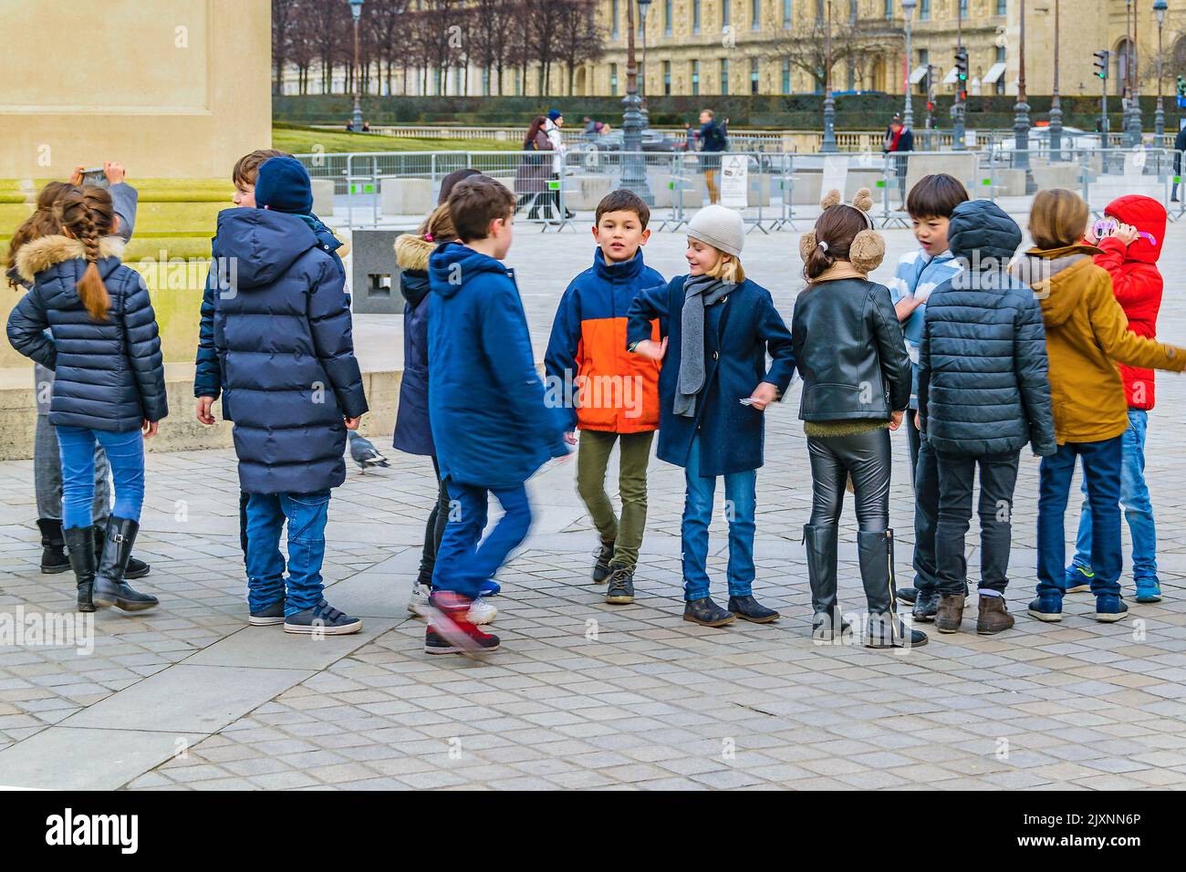 PARIS, FRANCE, JANUARY 2022 Kids in line waiting to enter to louvre