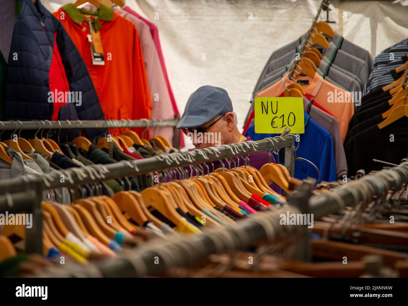 Man browsing at an outdoor market in Amsterdam Stock Photo