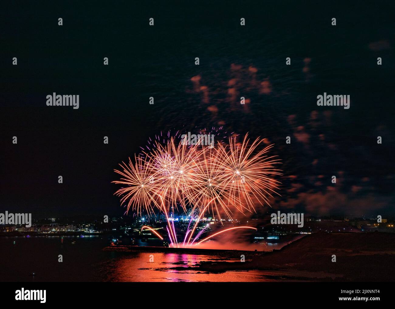 A display of colorful fireworks in dark sky during British firework ...