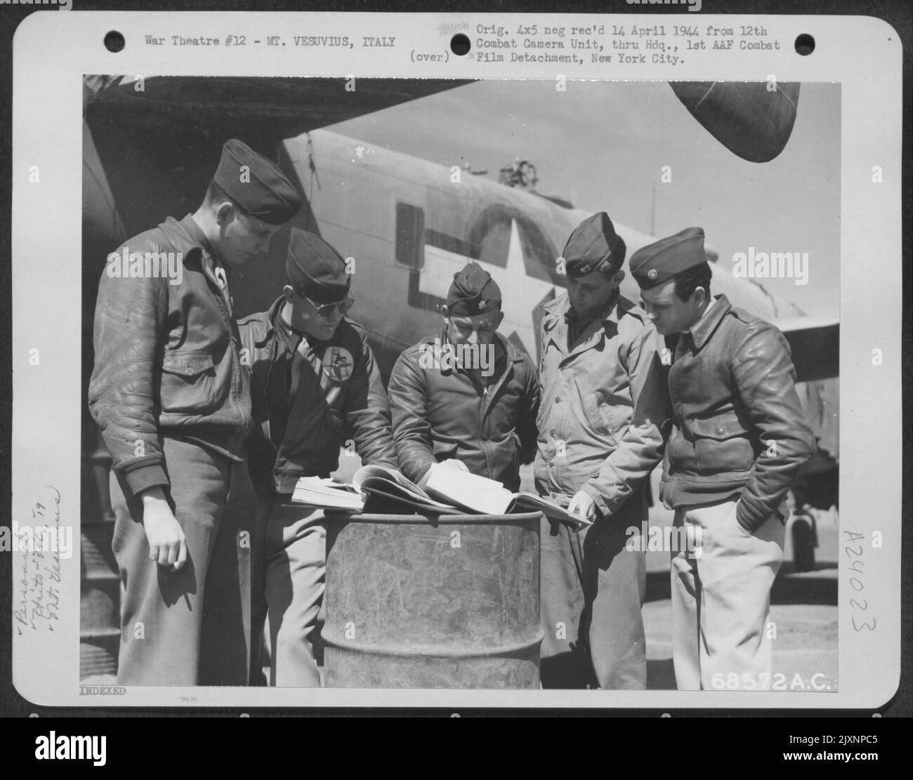Officers Of The 340Th Bomb Group And Officals From Several Airplane Factories Discuss The Replacement Of Parts To Planes Damaged By Cinders And Ashes During The Eruption Of Mt. Vesuvius On 23 March 1944. They Are, Left To Right: G.T. Clark Of Bendix Turr Stock Photo