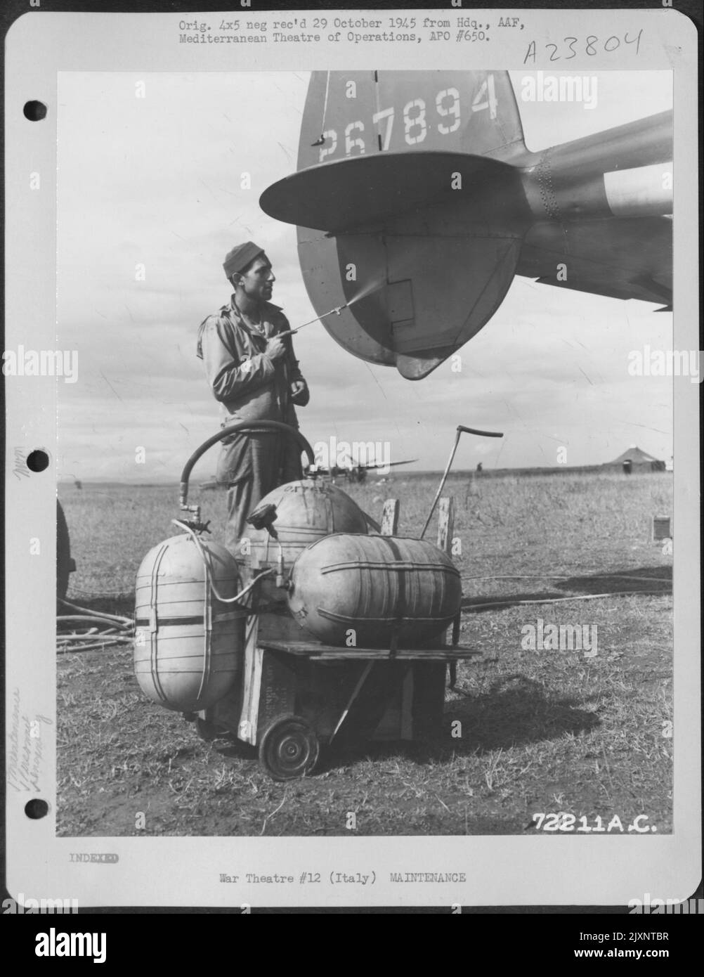 S/Sgt. Edward Lapinsky Of Kingston, Pa, Demonstrates The Handy Spray He