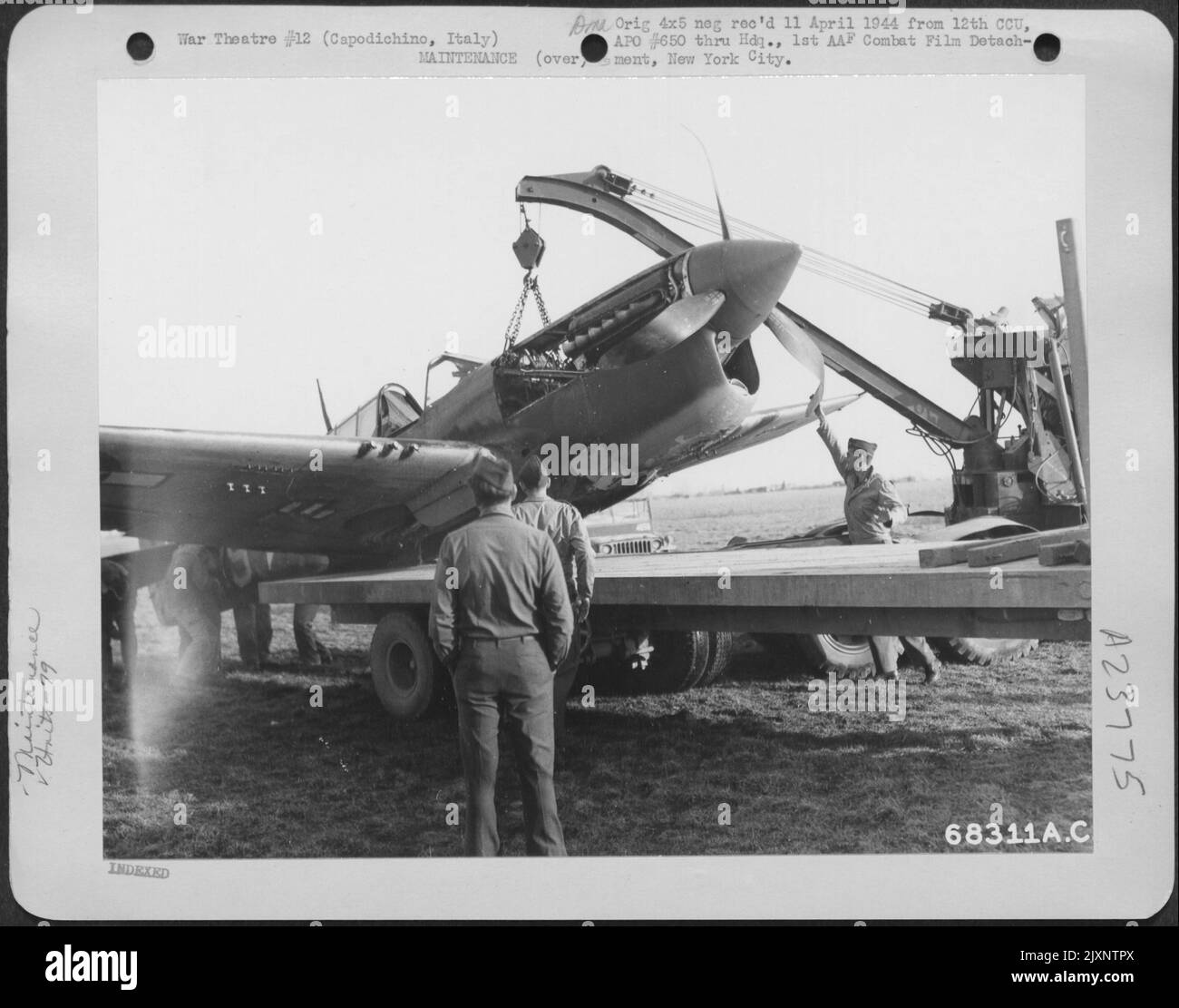 Maintenance Men Haul Away A Curtiss P40 Warhawk Of The 79Th Fighter