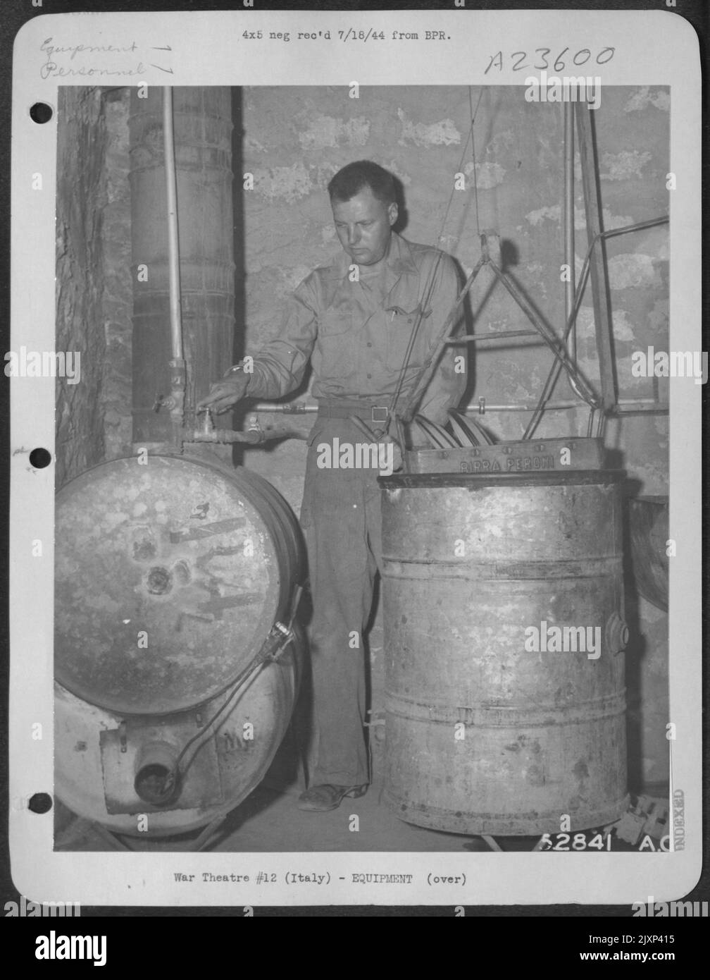 ITALY-Photographic report of improvised sanitary devices. Gasoline drums in left of photo are used as heating unit for dish washing device. Materials for heating unit: 40-feet 3/4 inch pipe and fittings or 1 1/2 inch tubing salvaged from planes many Stock Photo