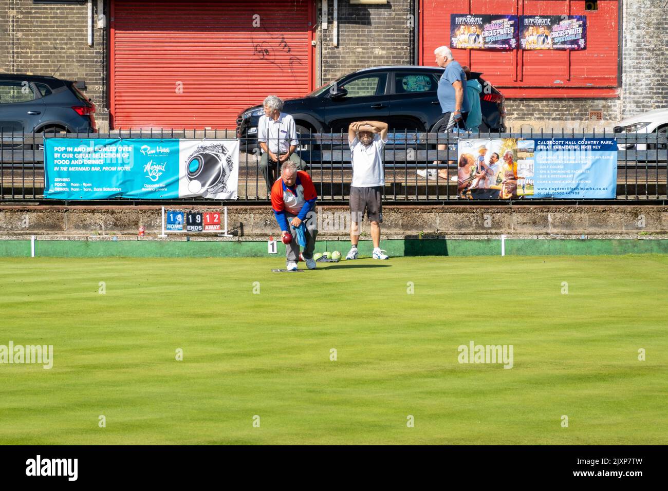 Great Yarmouth bowling Greens with player competing on a summers day Stock Photo