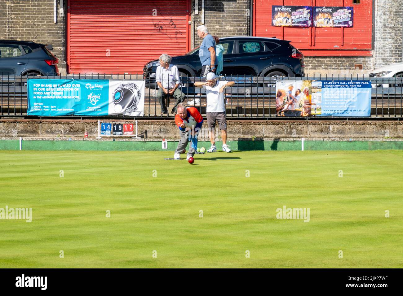Great Yarmouth bowling Greens with player competing on a summers day Stock Photo