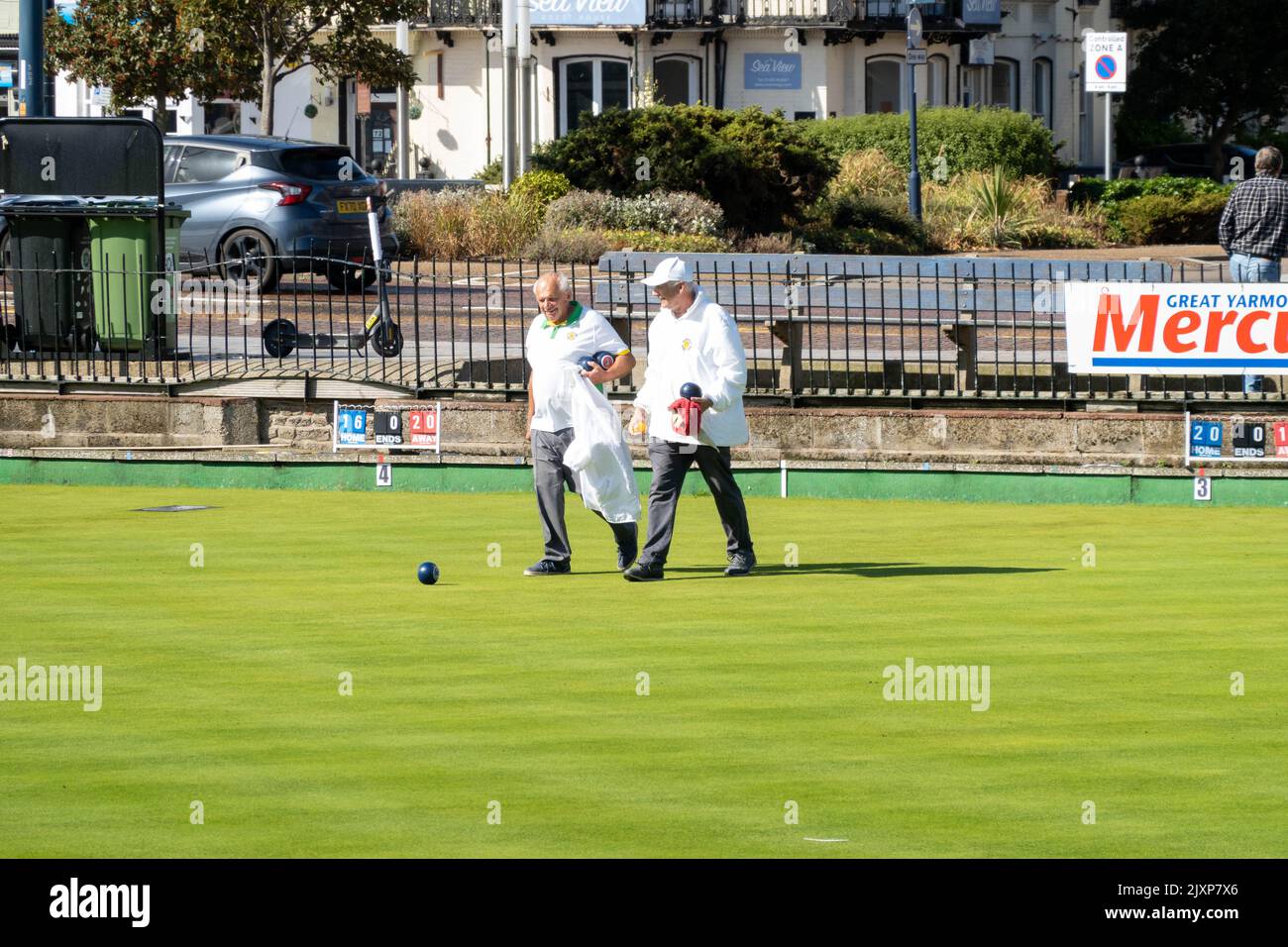 Great Yarmouth bowling Greens with player competing on a summers day
