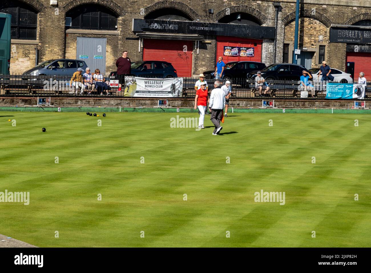 Great Yarmouth bowling Greens with player competing on a summers day