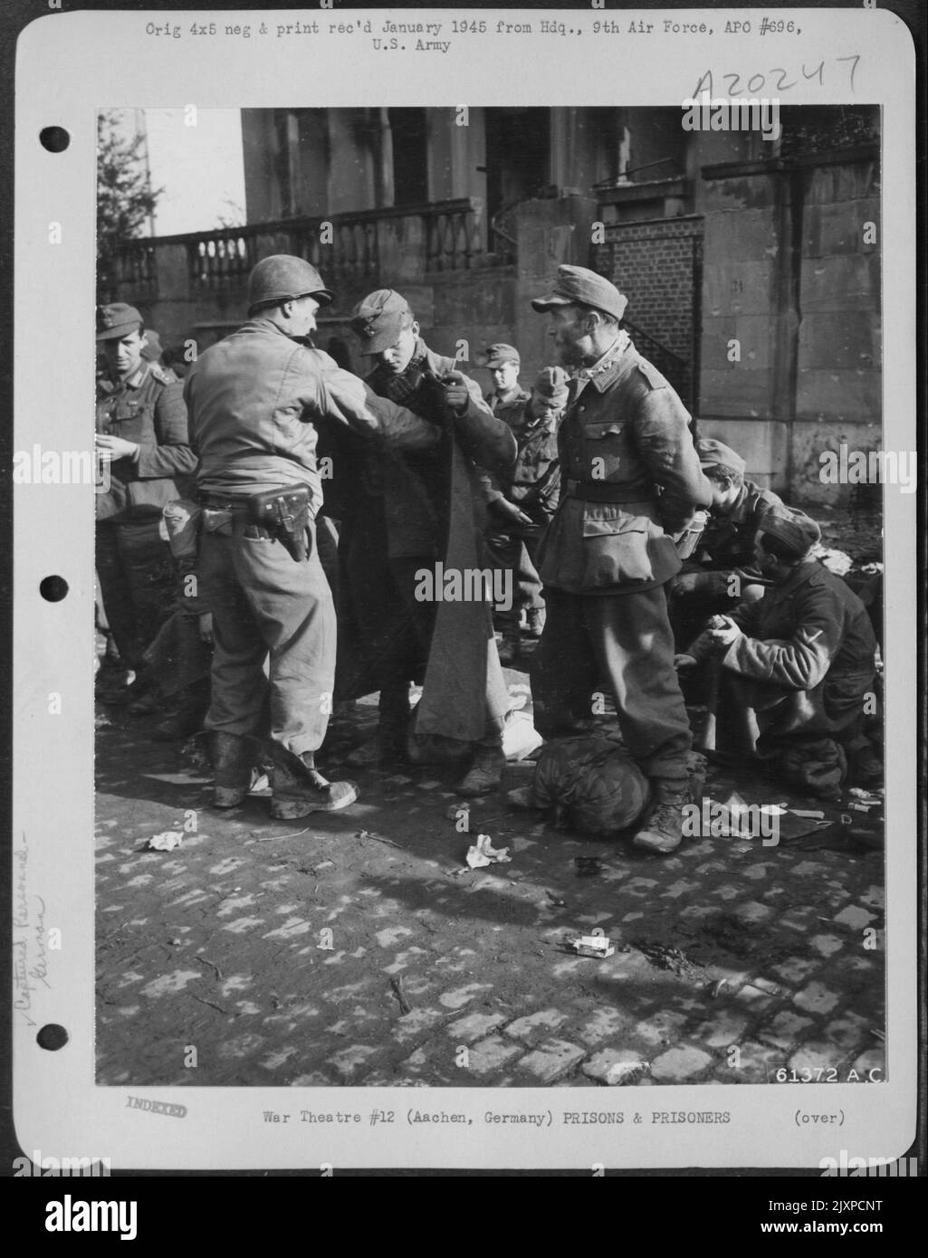 German Prisoners Of War Being Searched By An American Solider Before