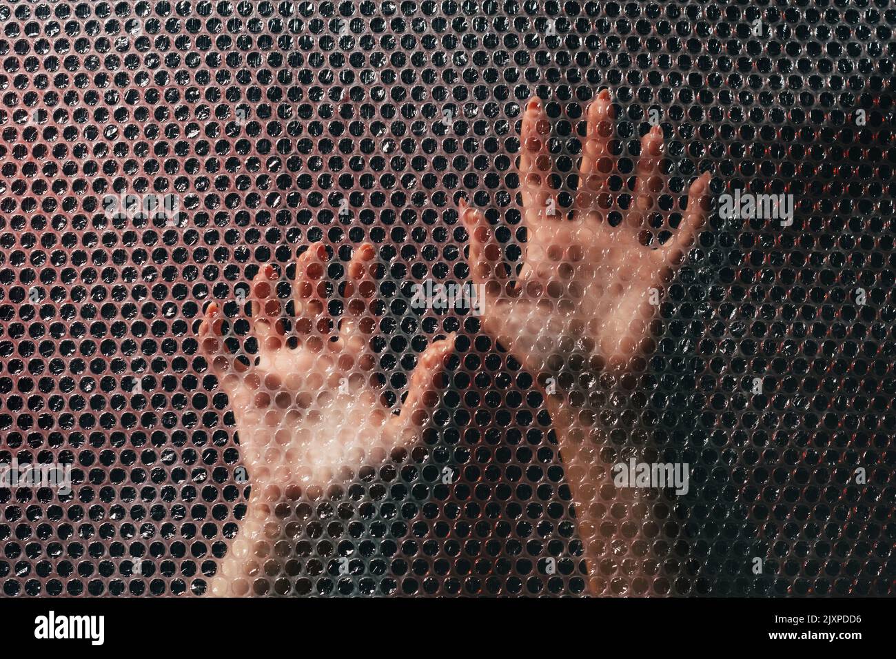 domestic violence hurt woman hands bubble wrap Stock Photo