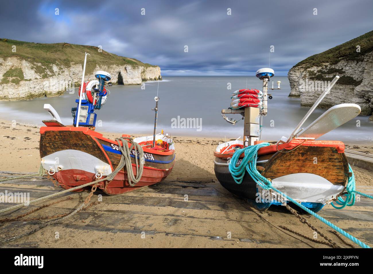 Boats at North Landing near Flamborough in Yorkshire captured using a long shutter speed. Stock Photo