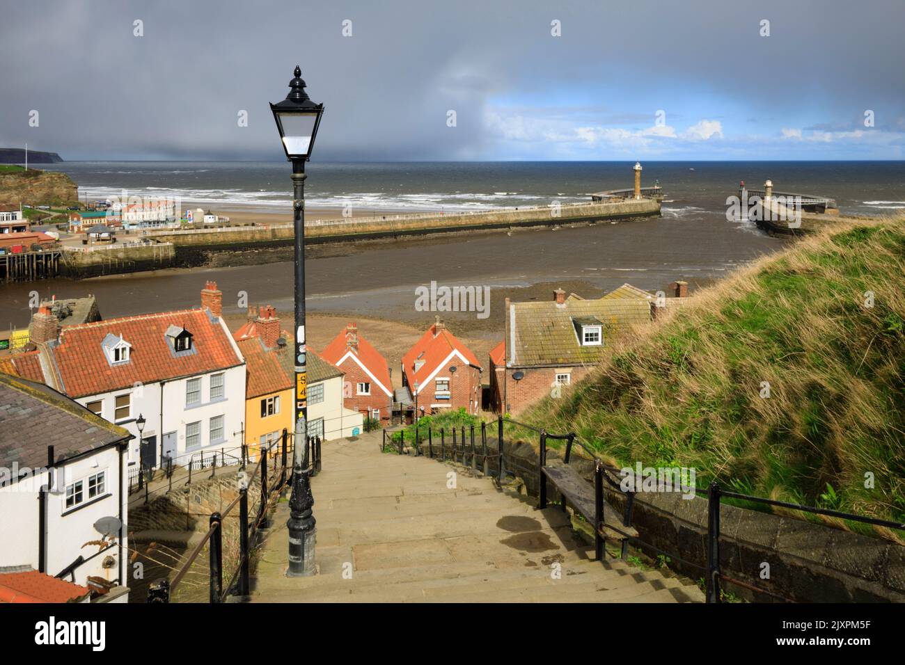 The piers at Whitby on the North Yorkshire Coast captured from 199 steps on a stormy afternoon. Stock Photo