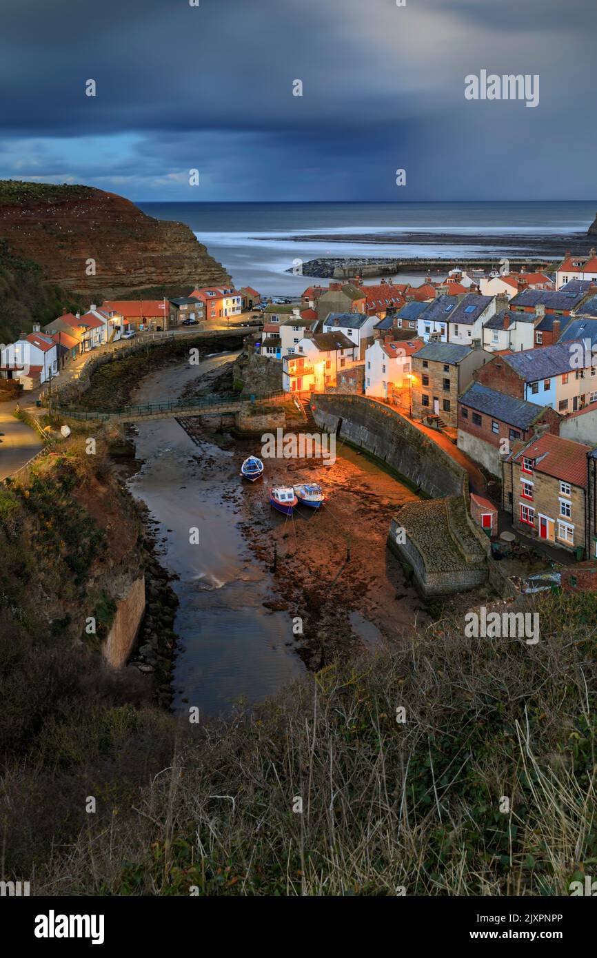 The picturesque village of Staithes on the North Yorkshire Coast captured on a stormy evening. Stock Photo