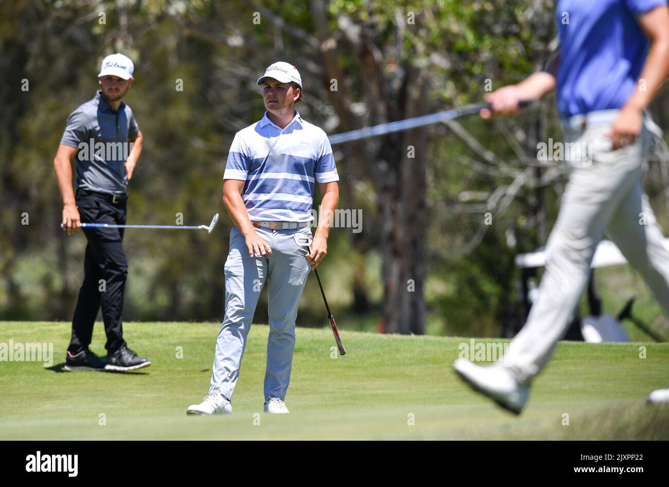 Golfer Jake McLeod (centre) of Queensland is seen during day four of ...