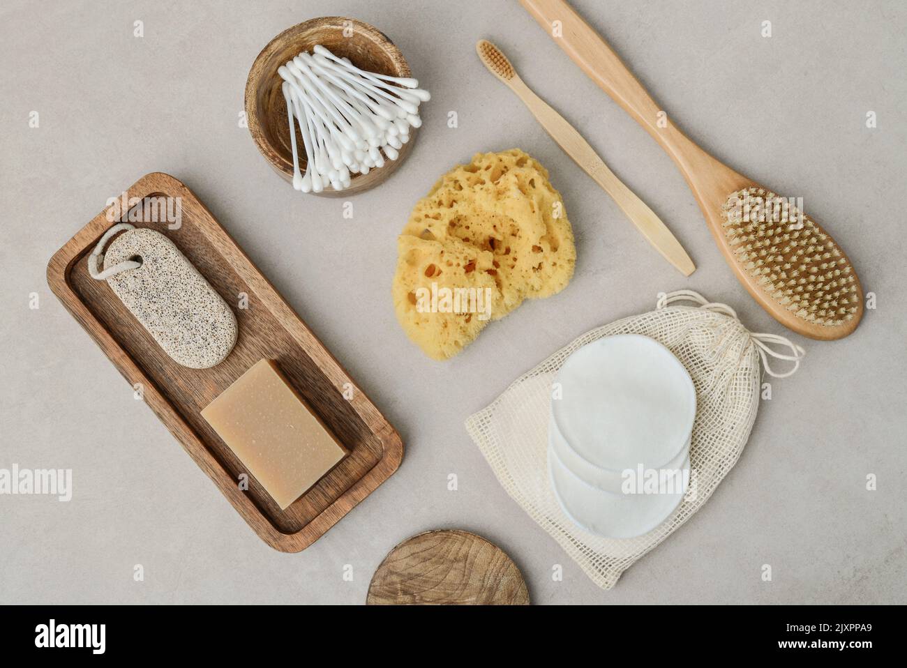 Set of various eco-friendly toiletries on a light concrete background, top view. Organic lifestyle and skin care products. Stock Photo