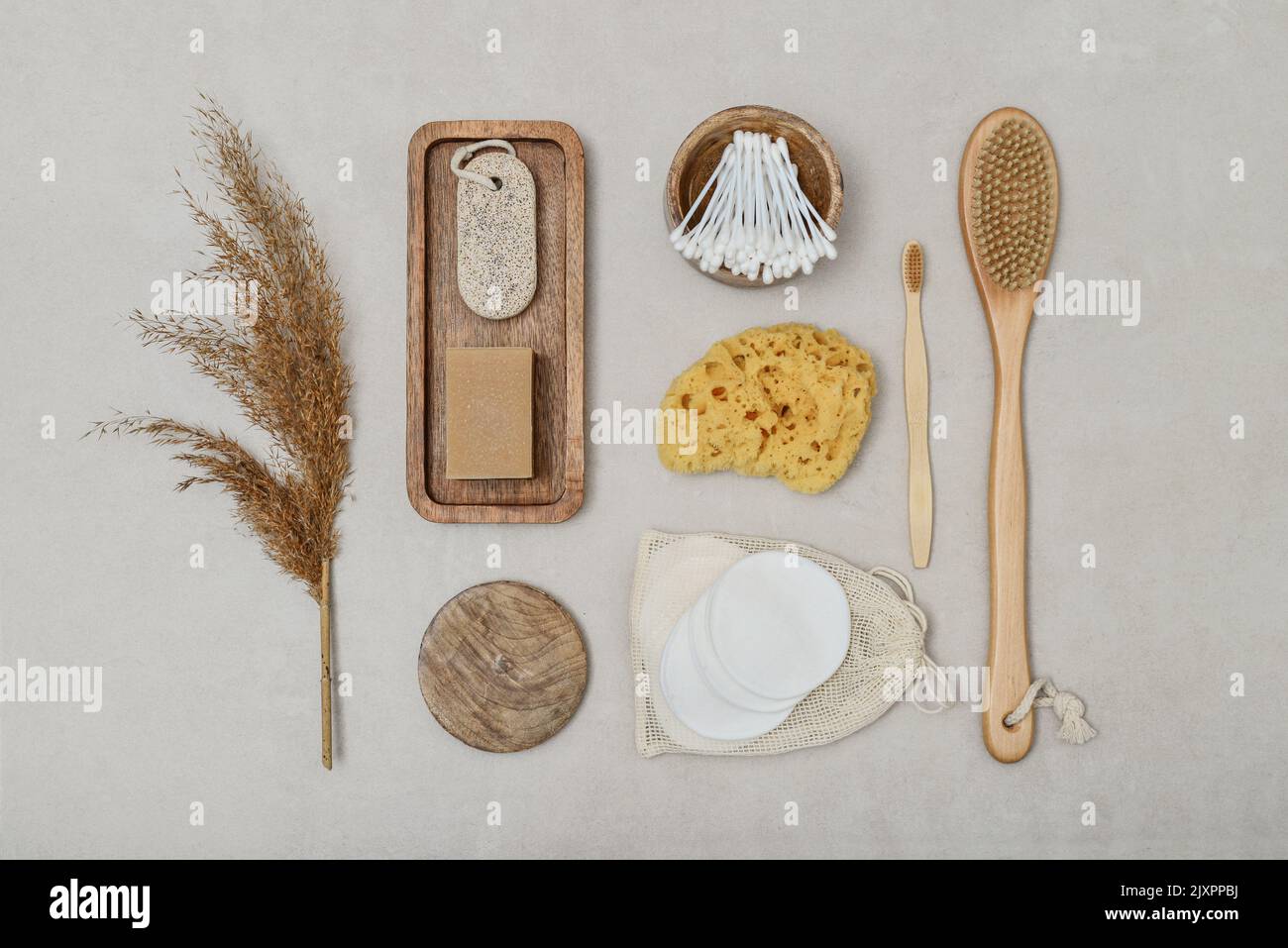 Set of various eco-friendly toiletries on a light concrete background, top view. Organic lifestyle and skin care products. Stock Photo