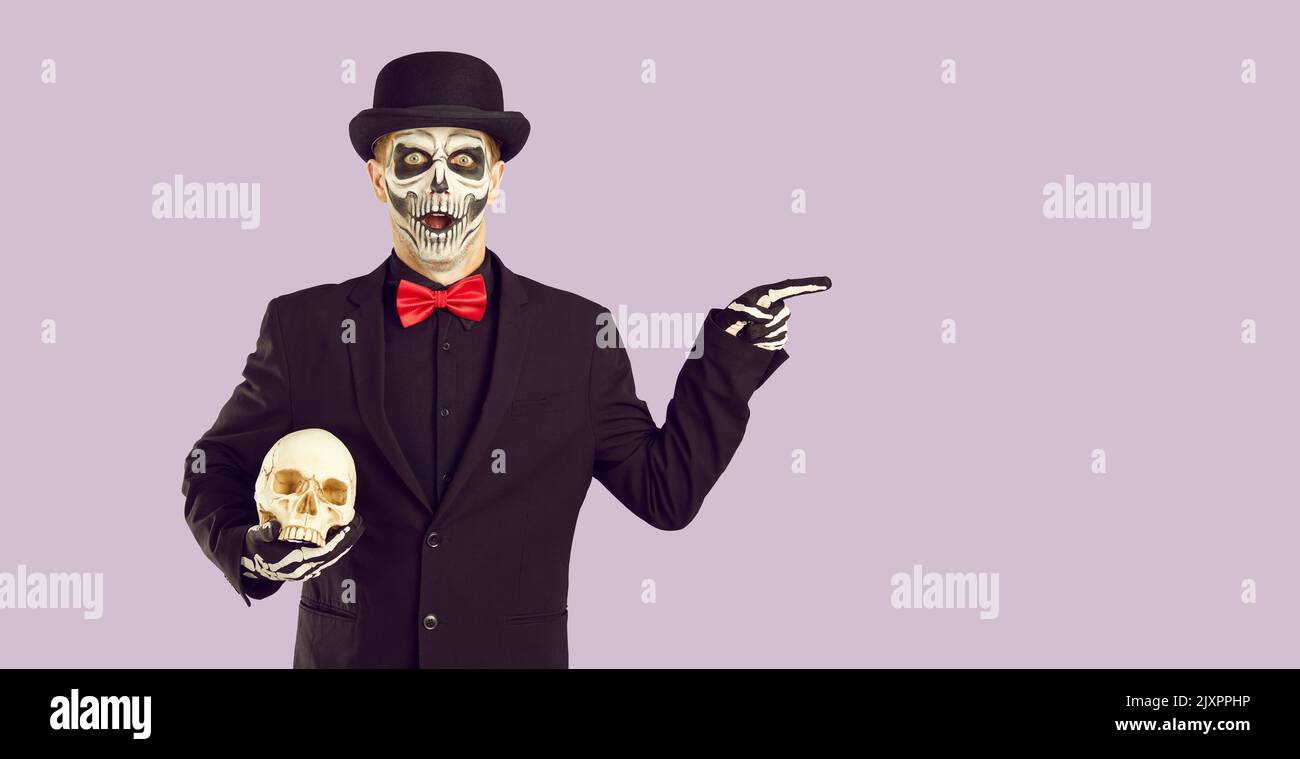 Man in Halloween costume with surprised and shocked expression is