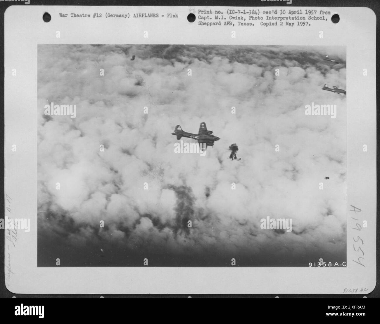Bursts Of Deadly Flak Explode Near A Boeing B17 "Flying Fortress