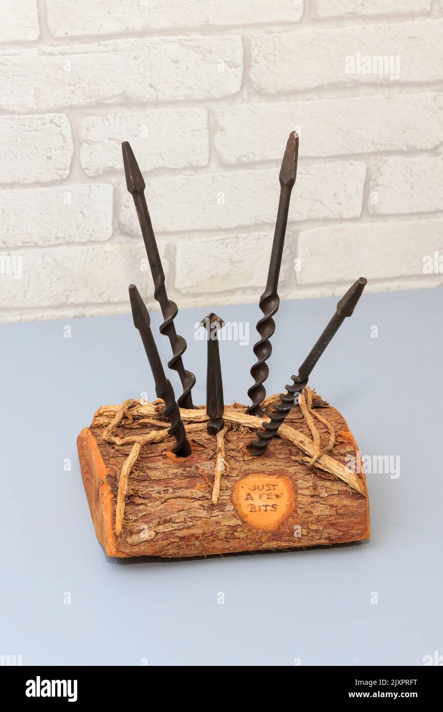 Home crafted wooden carpenters drill bit stand complete with four wood drill bits and counter