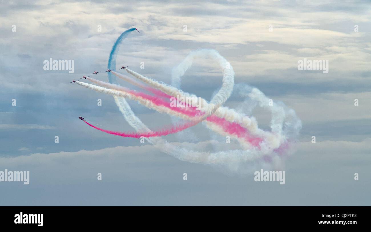 Royal Air Force Red Arrows Aerobatic Display Team Doing A Tornado Manoeuvre With Red, White And Blue Smoke, Bournemouth Air Festival 2022 UK Stock Photo