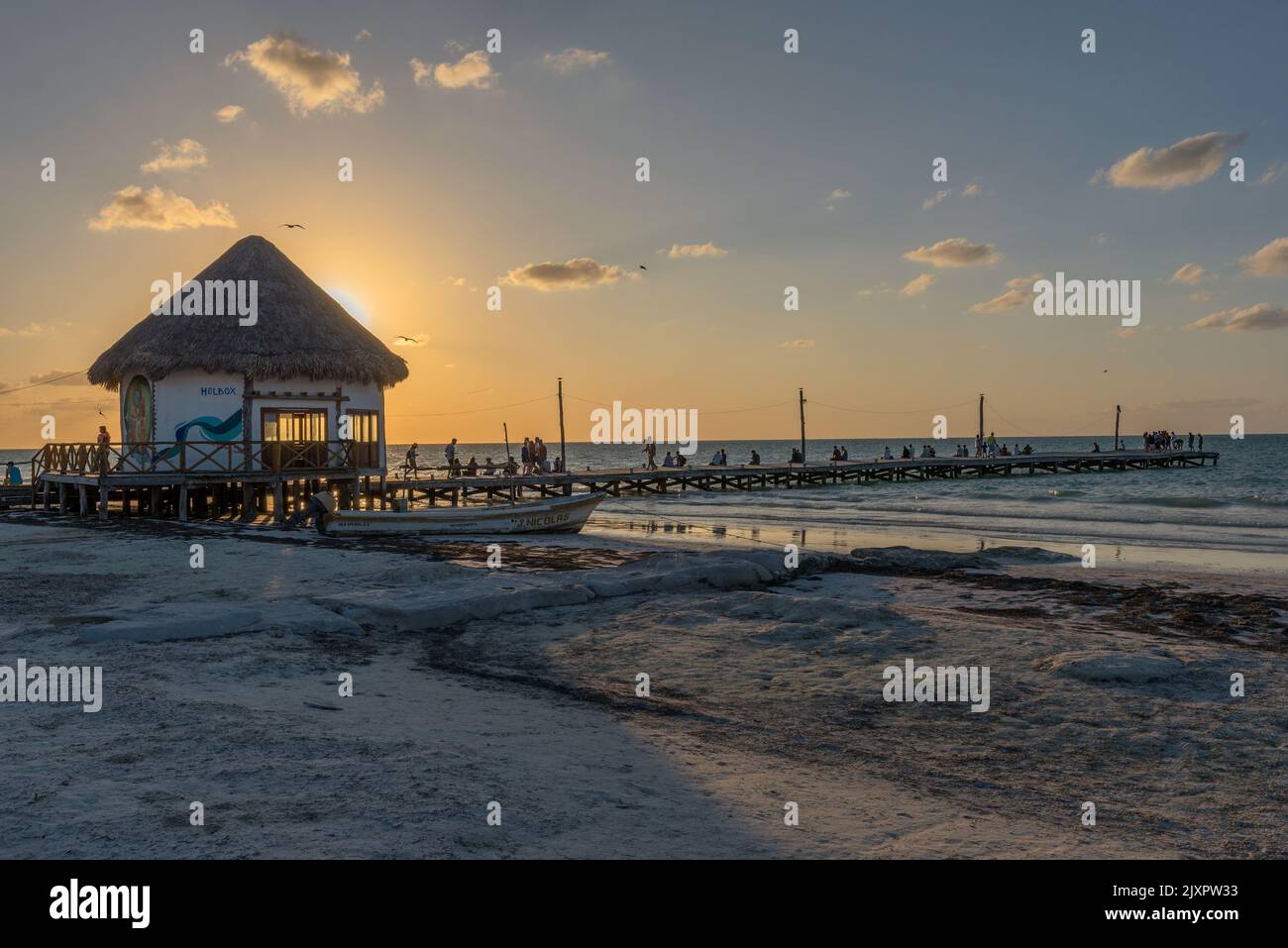 Unidentified people at sunset on the beach of Holbox Island, Mexico Stock Photo