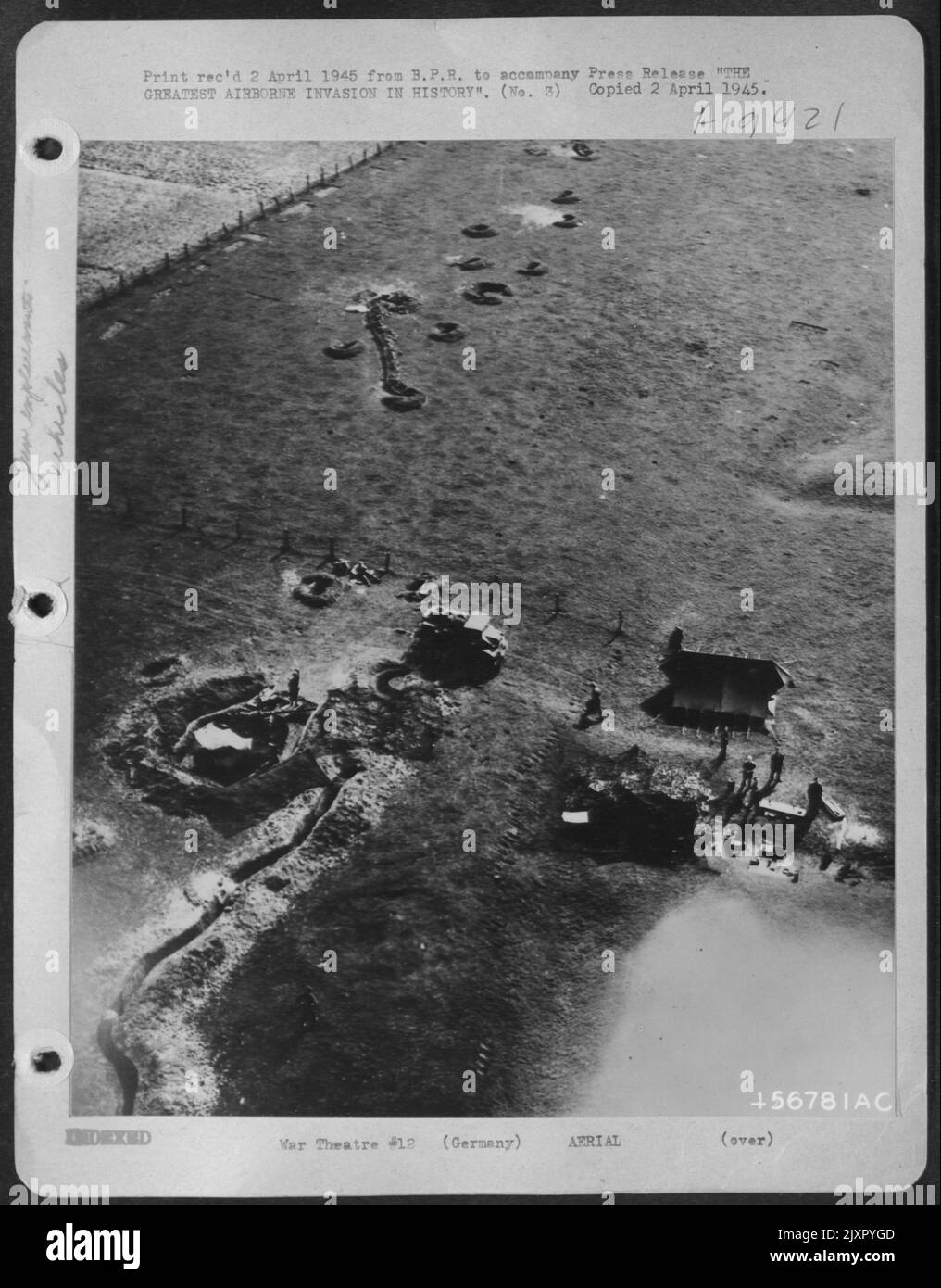 THE GREATEST AIRBORNE INVASION IN HISTORY--B-24 Liberators of the U.S. Army 8th Air Force winging in only 100 feet above the ground March 24th on their mission to drop supplies in the Wesel area, made this photograph of Allied anti-aircraft Stock Photo
