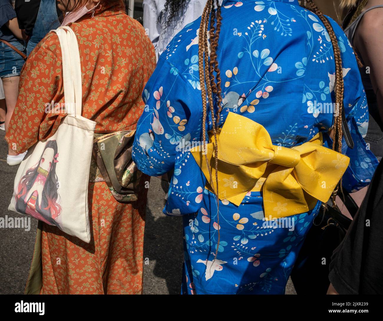 Women wearing kimonos at a Japanese themed street fair in New York on