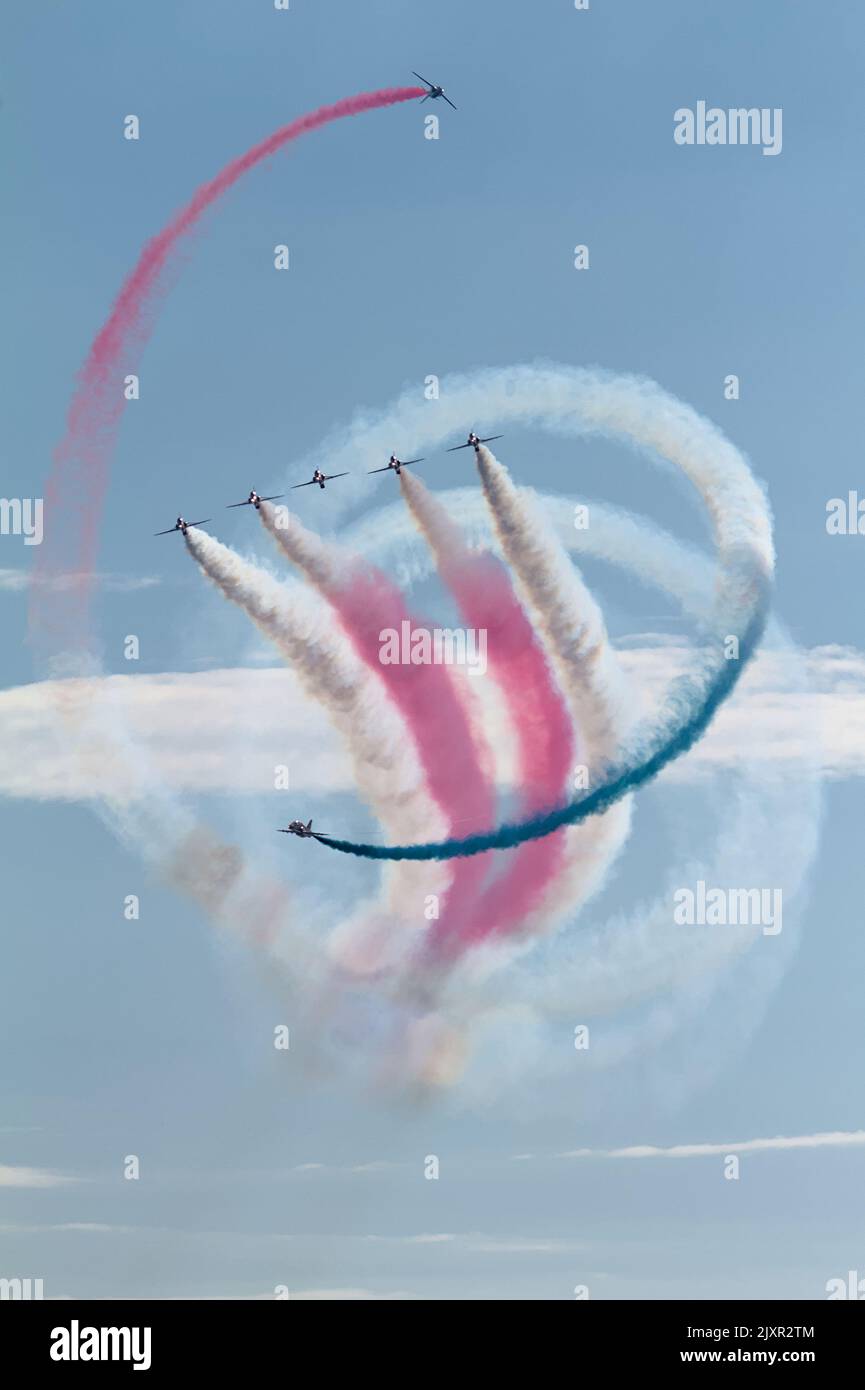 Royal Air Force Red Arrows Aerobatic Display Team Doing A Tornado Manoeuvre With Red, White And Blue Smoke, Bournemouth Air Festival 2022 UK Stock Photo