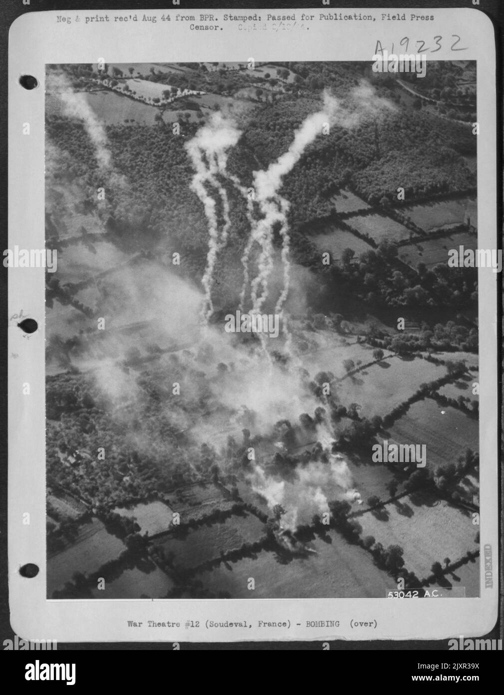 Smoke rises from bombed out German positions, three miles SW of