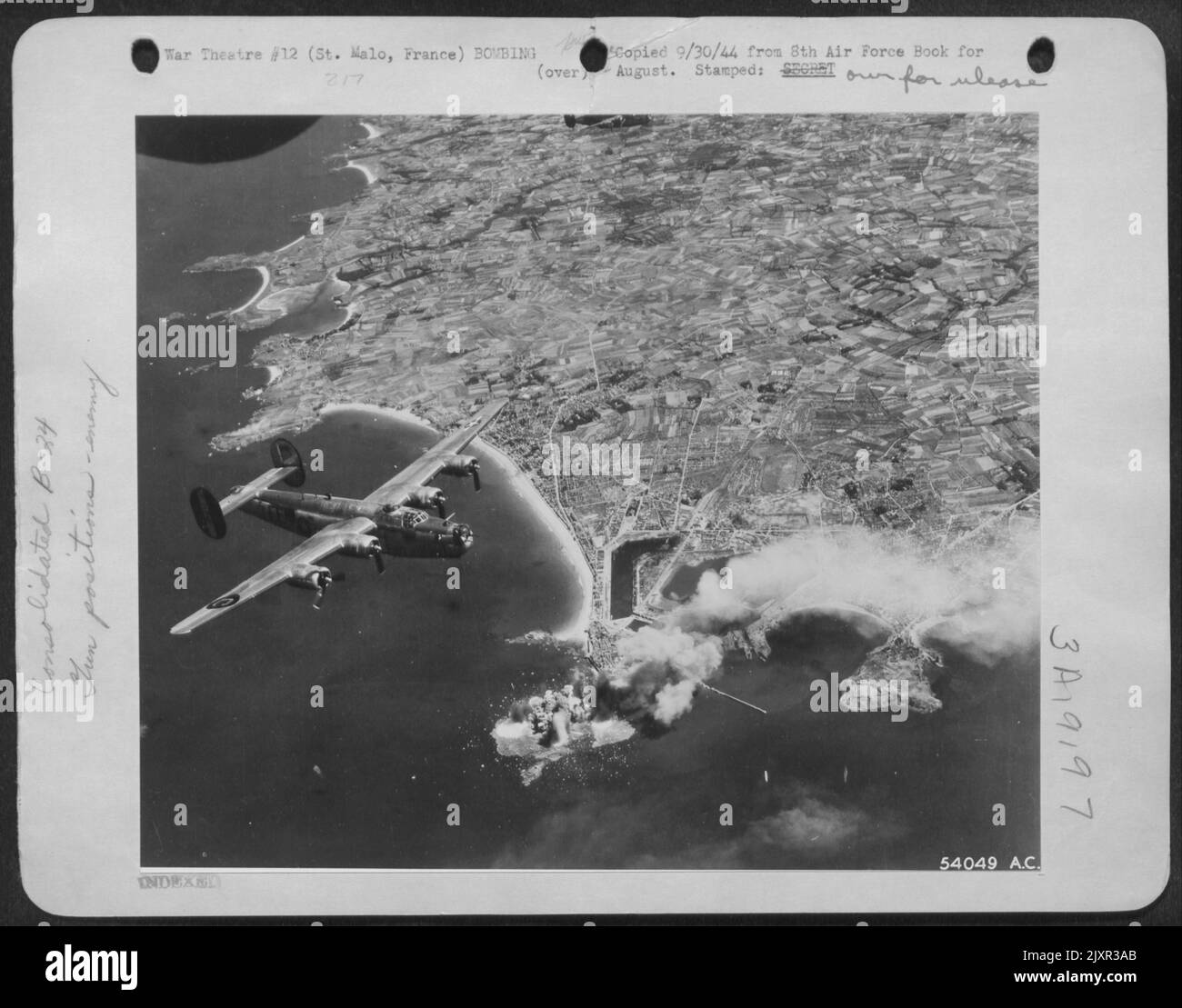 St. Malo Island, defended by the Nazis, is hidden under bomb bursts