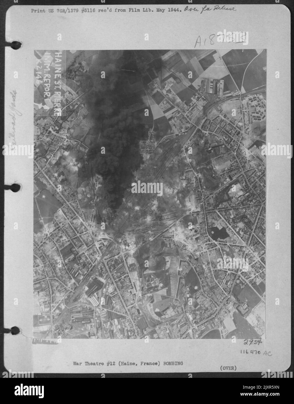 Enemy Industrial Sites At Haine / St. Pierre Marshalling Yards, France Is Raided On 9 May 1944. Many Wagons Are Off The Rails, And A Possible Wagon Or Locomotive Repair Shop Is Destroyed. An Oil Store Is Still Burning. Stock Photo