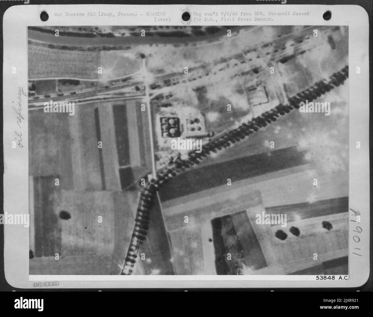 These three photos reveal what happened 18 Aug 44, when 8th AF bombers attacked the German oil depot at Pacy, near Evereux, France. This gives an idea of the minute size of targets presented to bomber crews when flying at great heights. Stock Photo