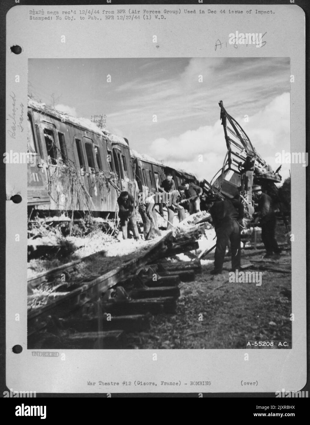 Gisors, France-German troop train, camouflaged with branches, didn't fool P-47 pilots. Stock Photo