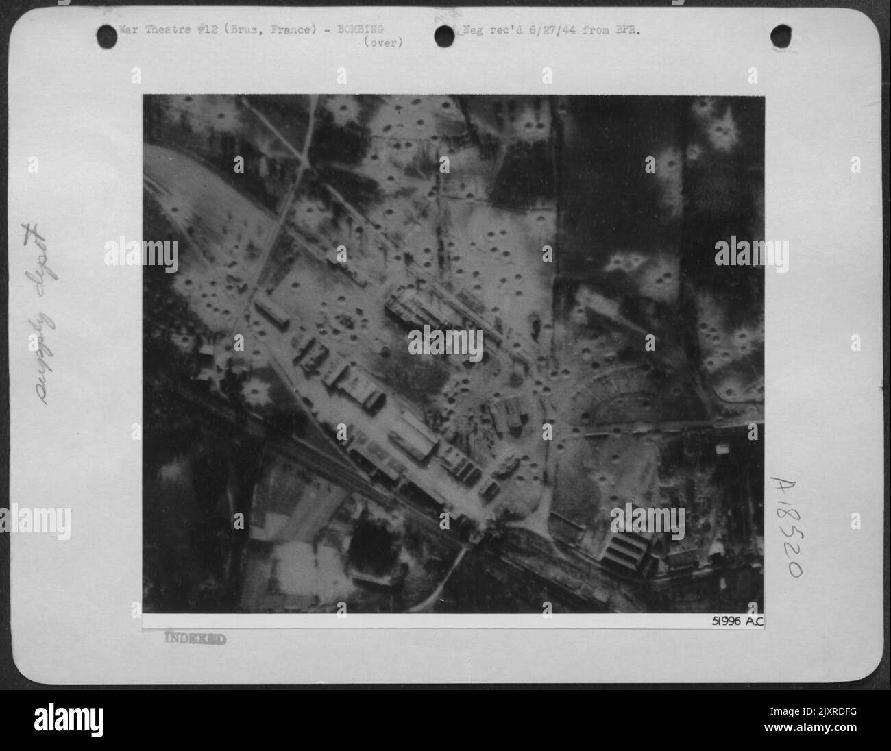 Direct hits severely damaged a large three bay building, two parallel